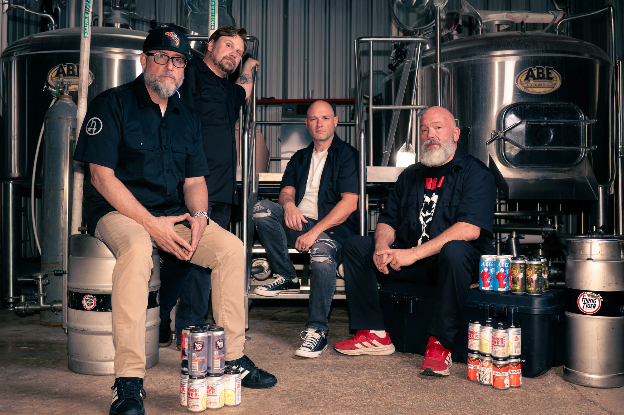 All four current members of Hidden Tracks together inside a brewery